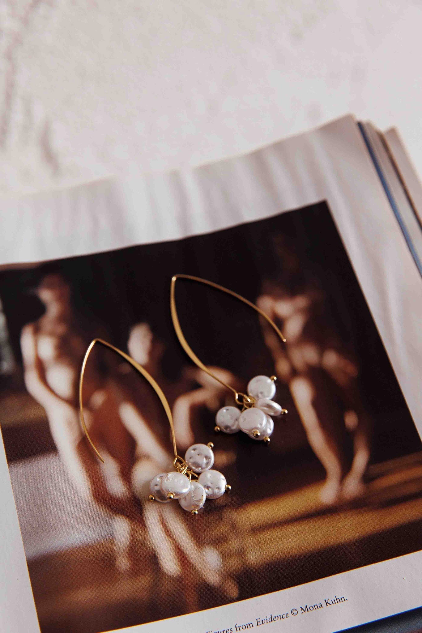 Long Hook Earrings with Golden Pearl Accents